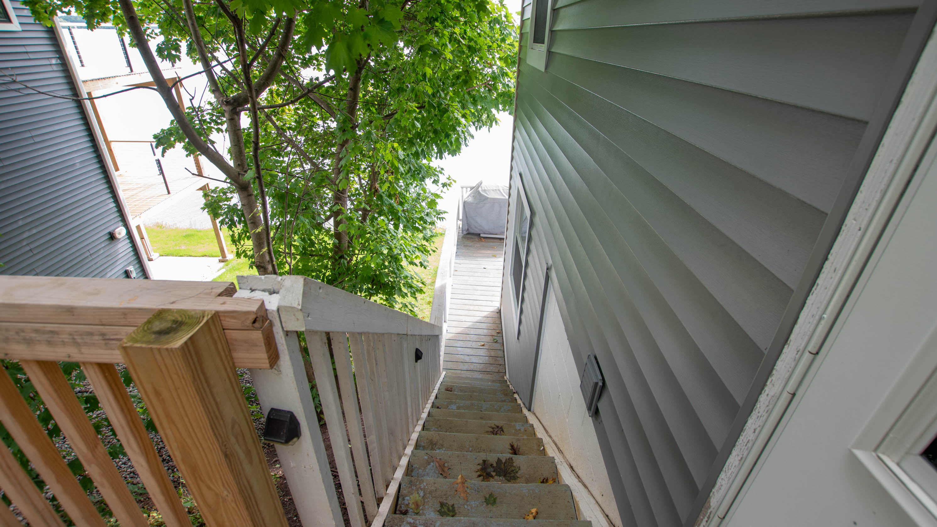 Convenient walkway leading between outdoor spaces and the deck.