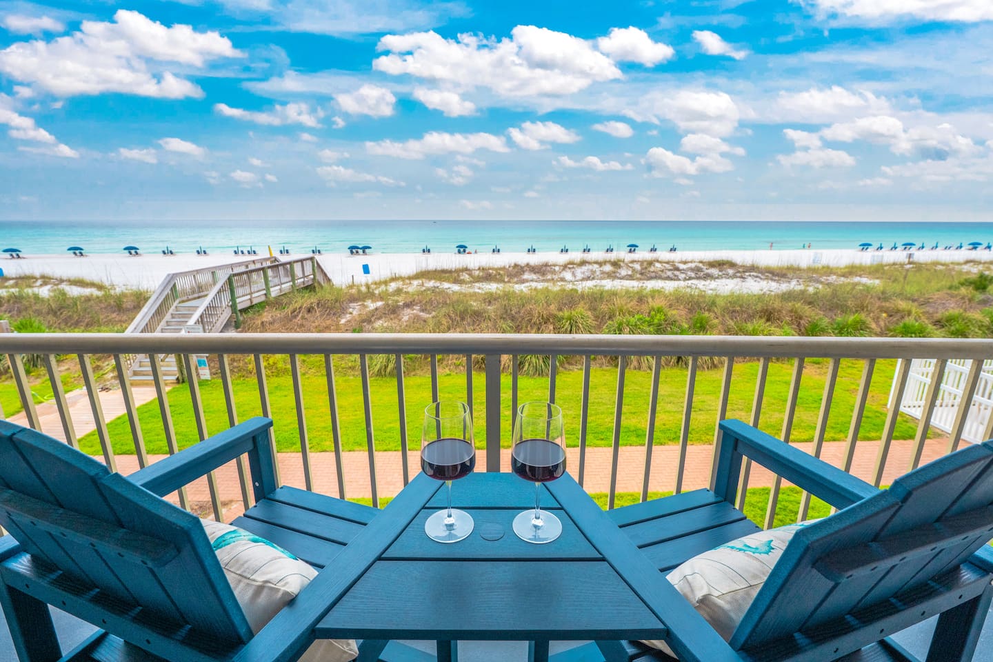 Private Gulf-front balcony overlooking Destin’s white sand and emerald water.