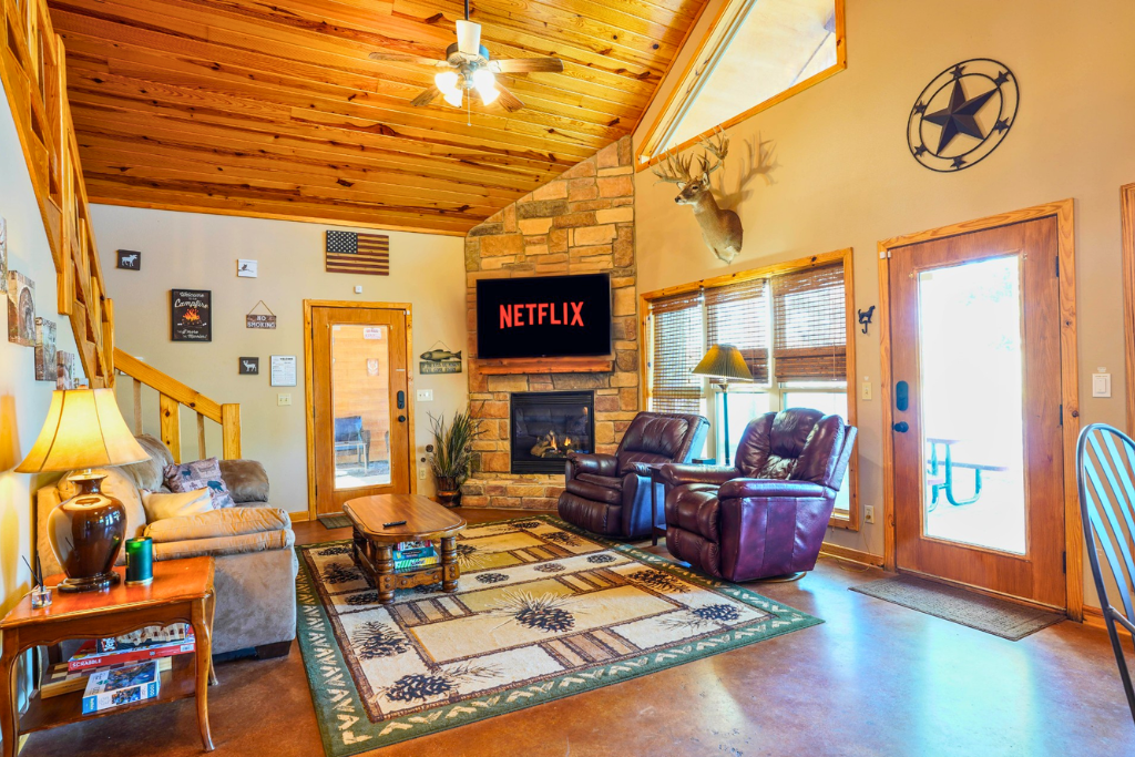 Vaulted great room with Smart TV, fireplace & comfortable seating for movie nights.