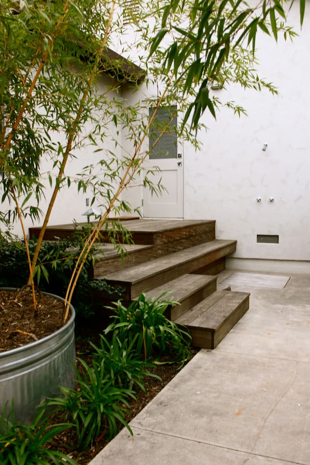 Outdoor shower with bathroom leading inside