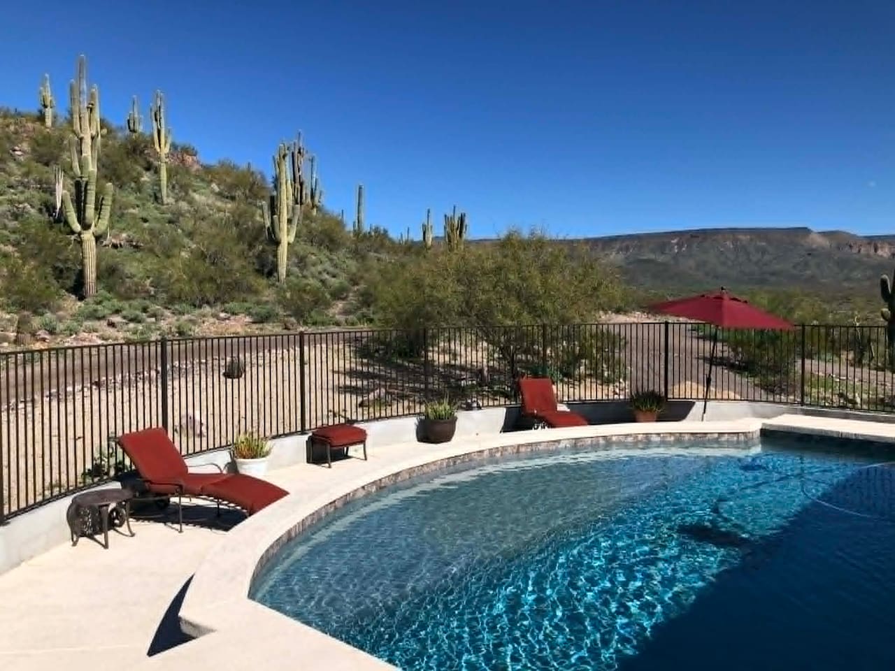 Take in the desert scenery from the pool, with lounge seating set up for sunny afternoons outdoors.