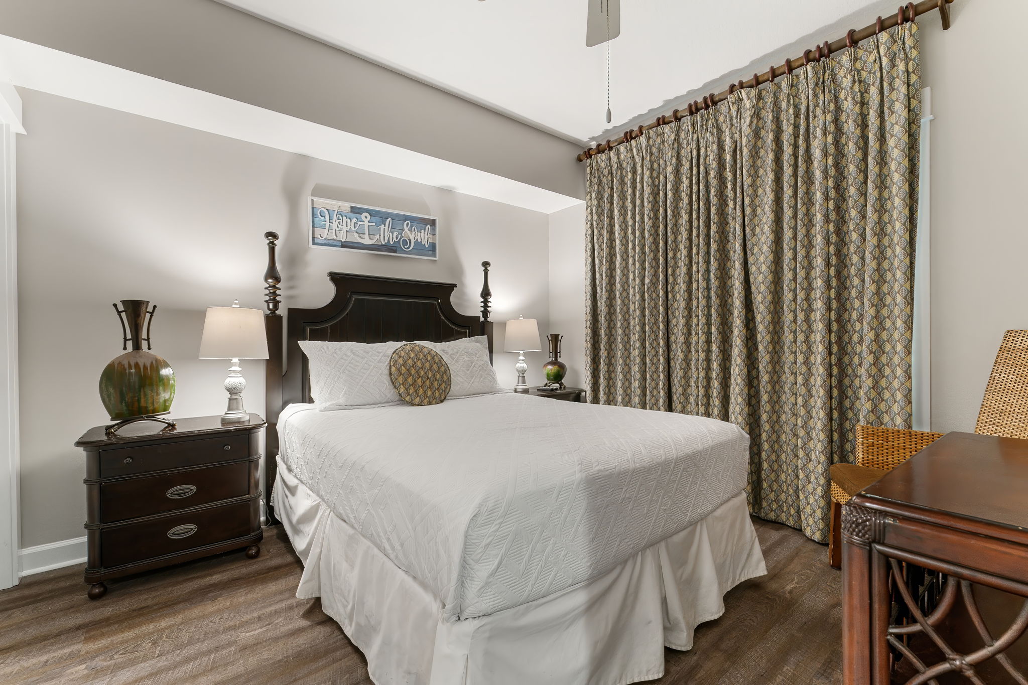 Queen size bed in guest room.