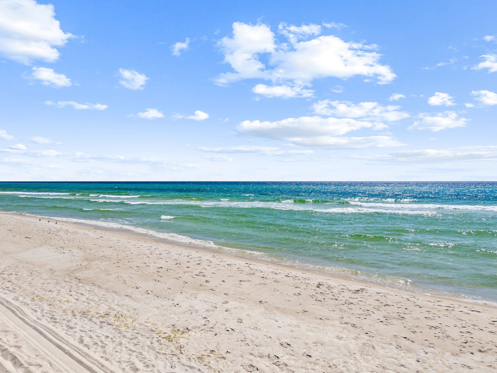 The beautiful white sand beach and blue water are just a short walk or bike ride away.