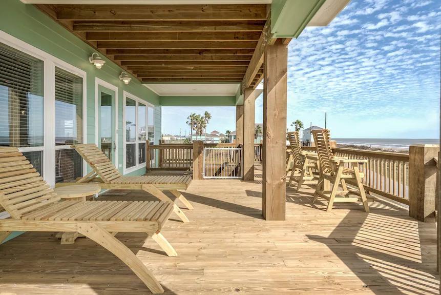 Breezy Point Exterior: Step outside onto this expansive deck and soak in breathtaking, panoramic views of the sparkling sea.