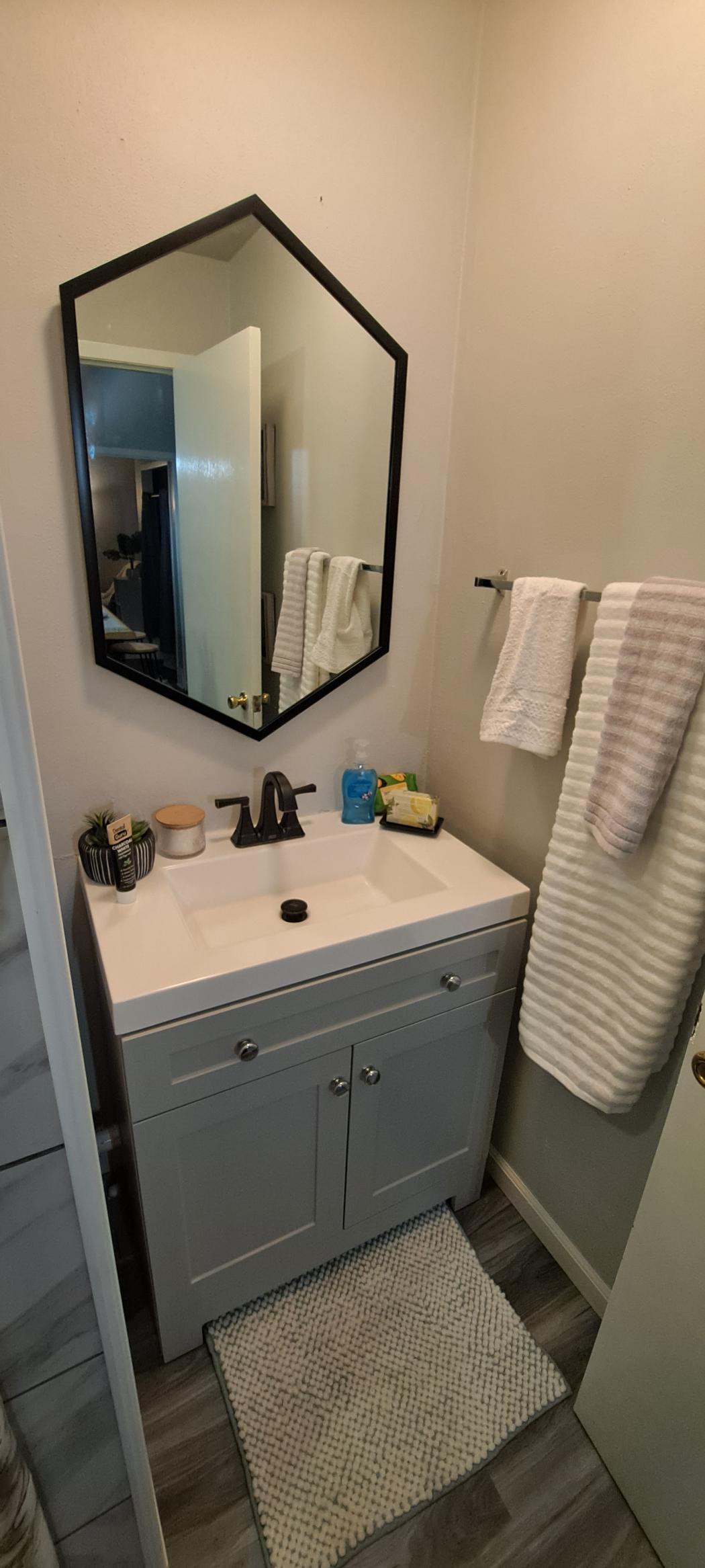 Spa-like bathroom with deluxe amenities and tub