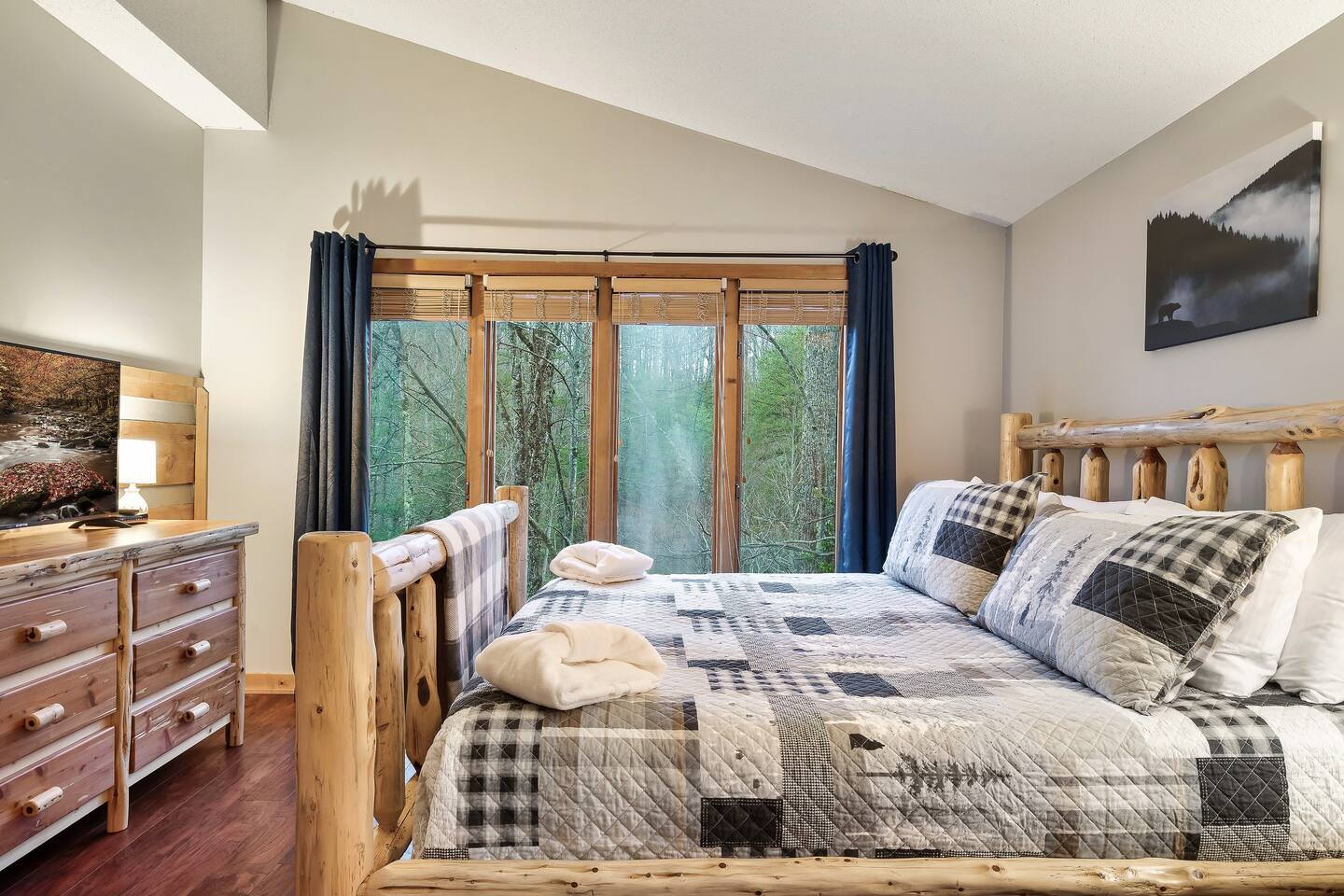 Sleep like a king or queen in this top floor master! Relax in this Amish-built, custom log bed. You'll sink into the pillow top mattress as you wind down and watch your favorite program.