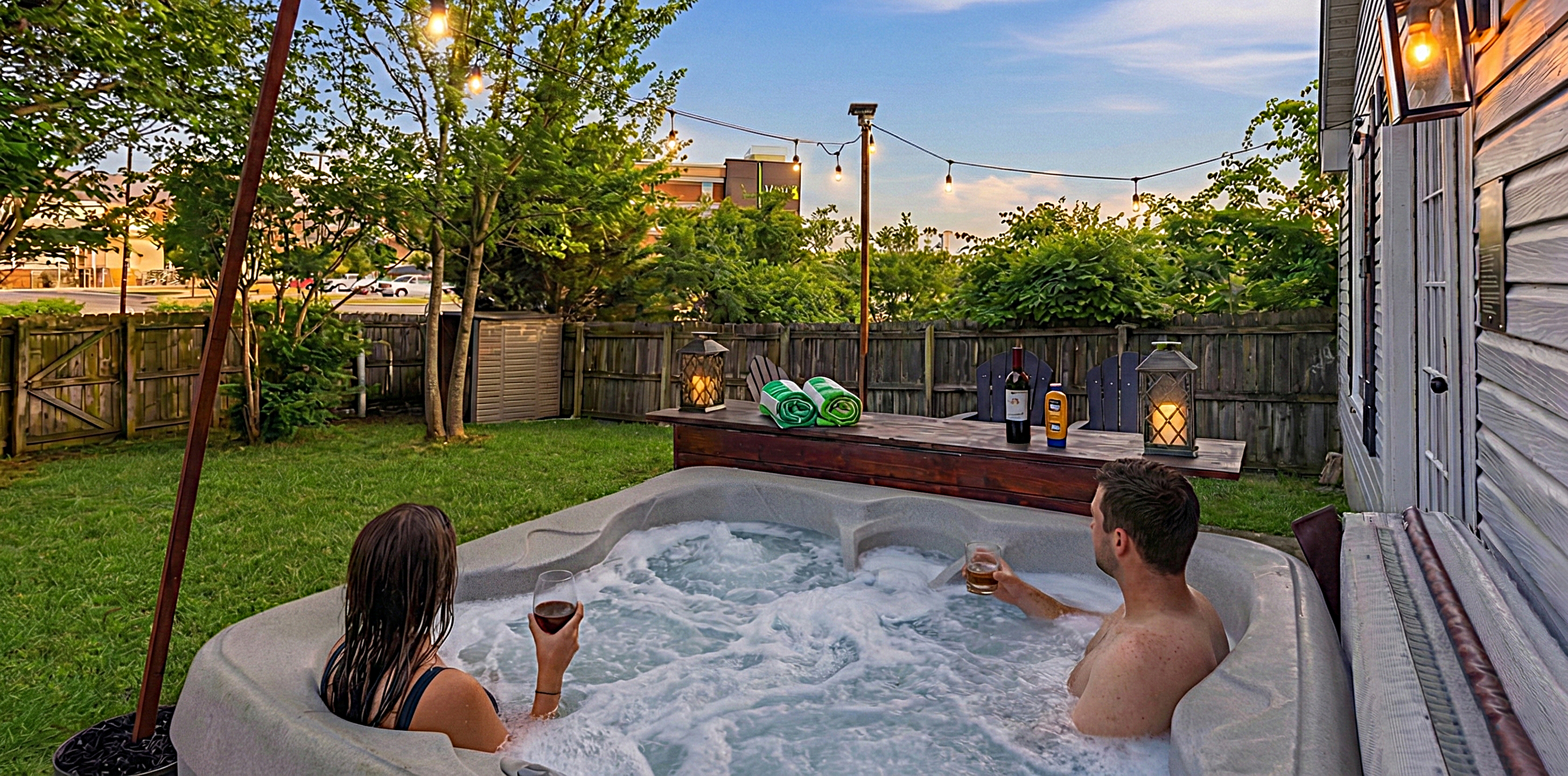 Relax in our private backyard hot tub under ambient solar-powered string lights! Open year-round! (just please no glass in the hot tub).