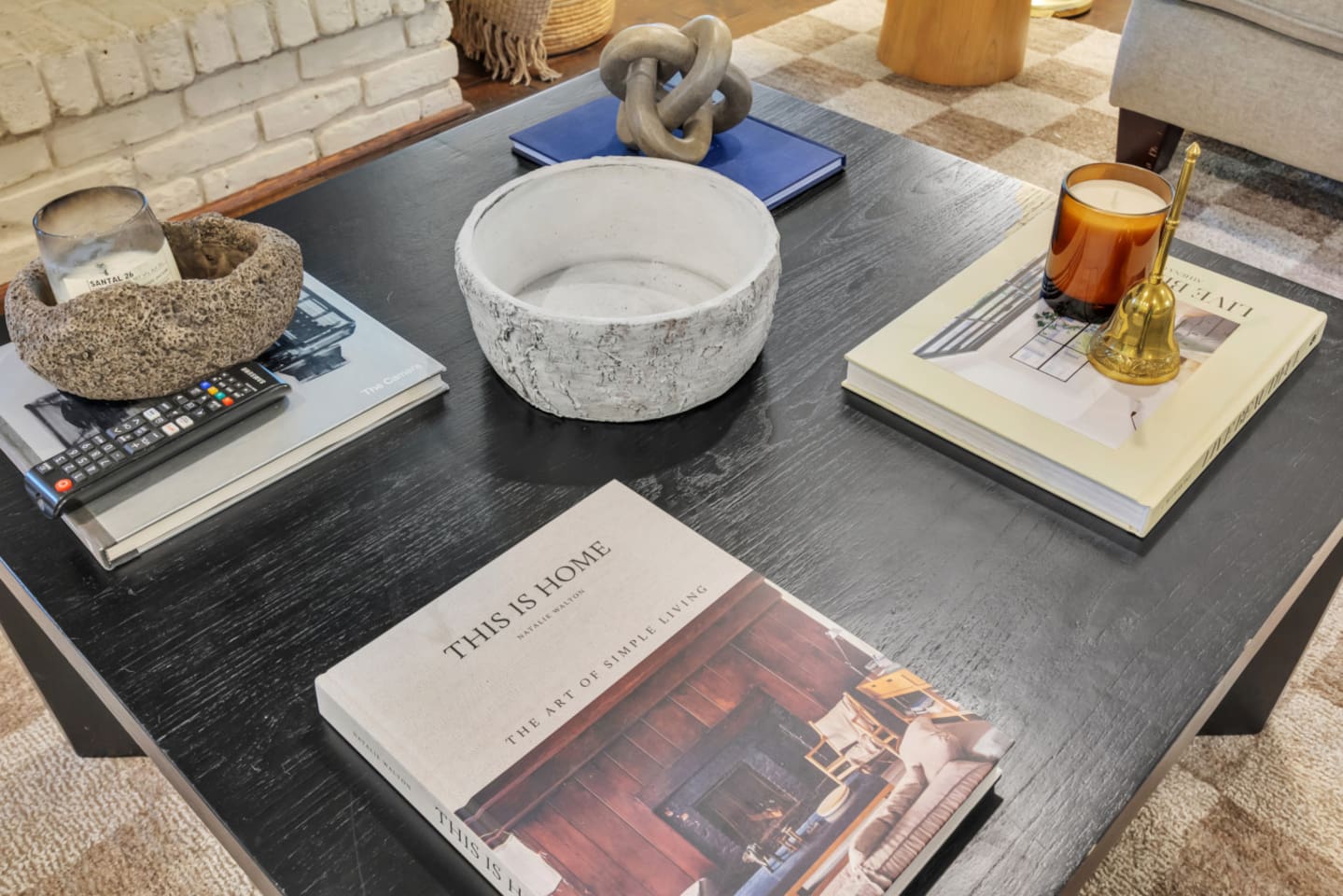 Elegant living room styled with curated artwork and decorative books on the coffee table, creating a refined yet comfortable space to relax, unwind, and enjoy the open-concept layout.