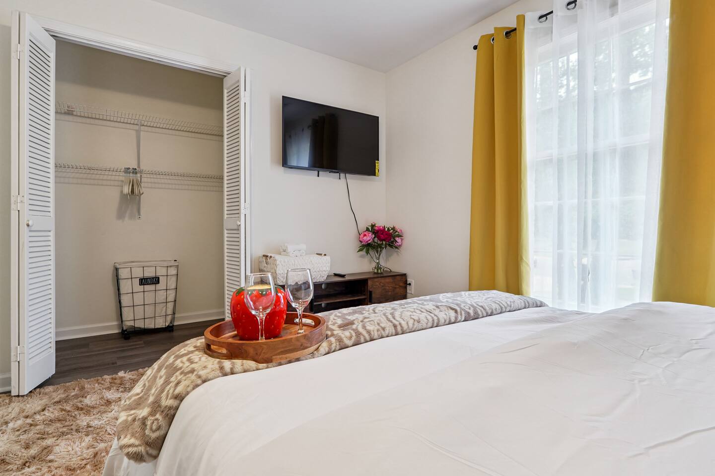 Another cozy bedroom featuring both a full bed and a twin bed, along with an Amazon Fire-powered Smart TV for your entertainment. This room includes 4 full-body towels, 4 washcloths, and 2 hand towels for your stay.