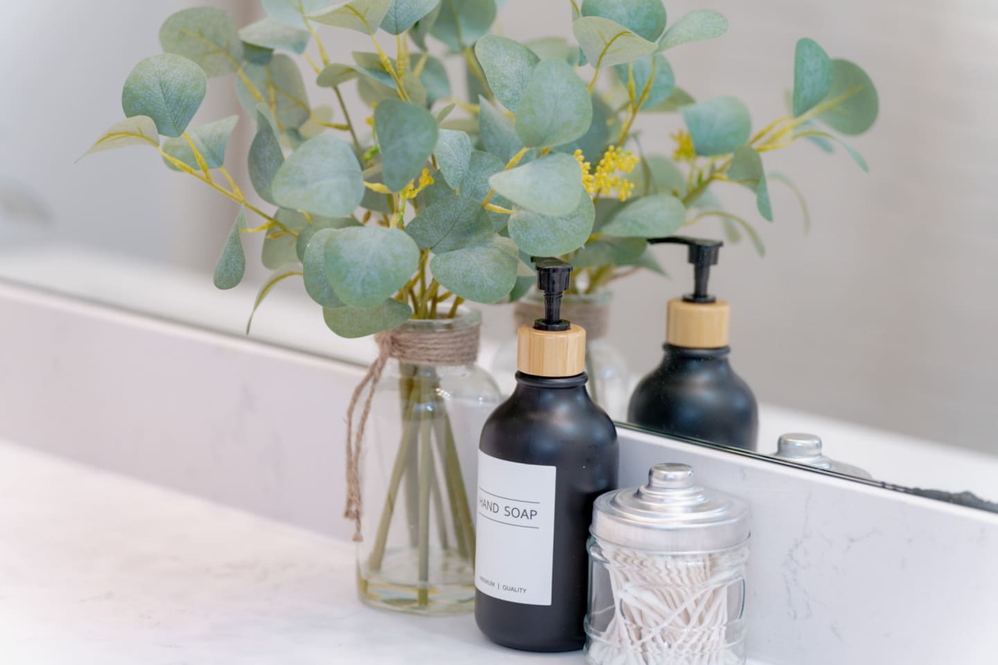 Elegant bathroom counter with floral accents and luxury touches.