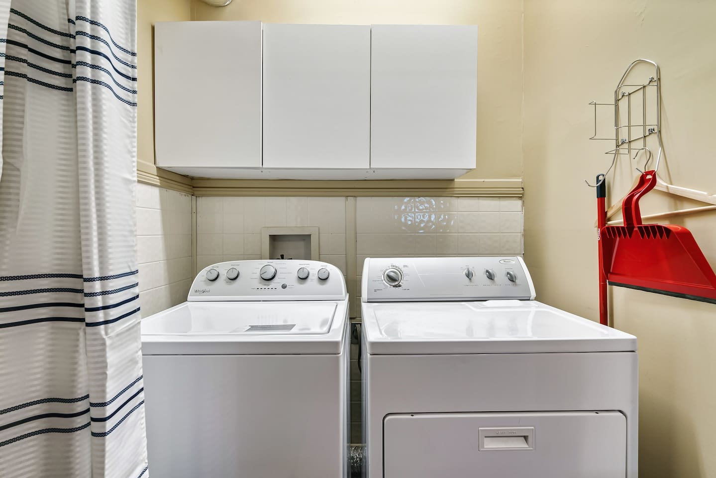 Full size washer & dryer are on the lower level, off of the basement-game room living room area.