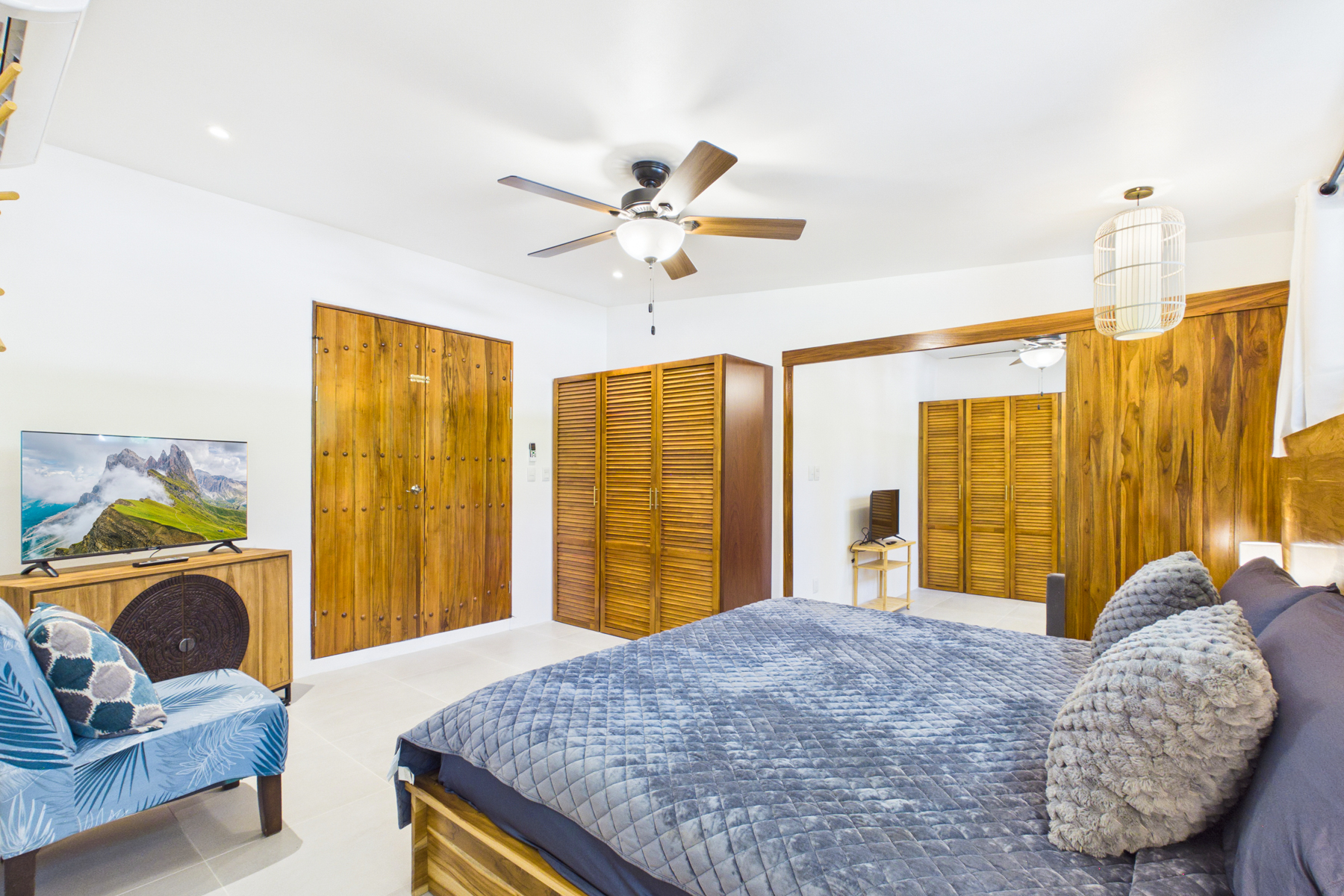Bedroom 3.  Brand new bedroom with a custom locally made king size bed and a smart tv.  This room offers so much flexibility!  It has it's own private entrance from the outdoor covered rancho, or double doors into bedroom 2 that can be locked for privacy. 