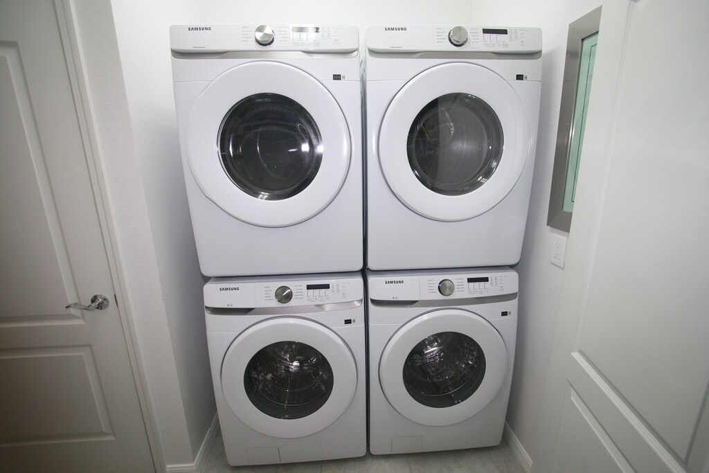 Great laundry room with 2 washers and 2 dryers