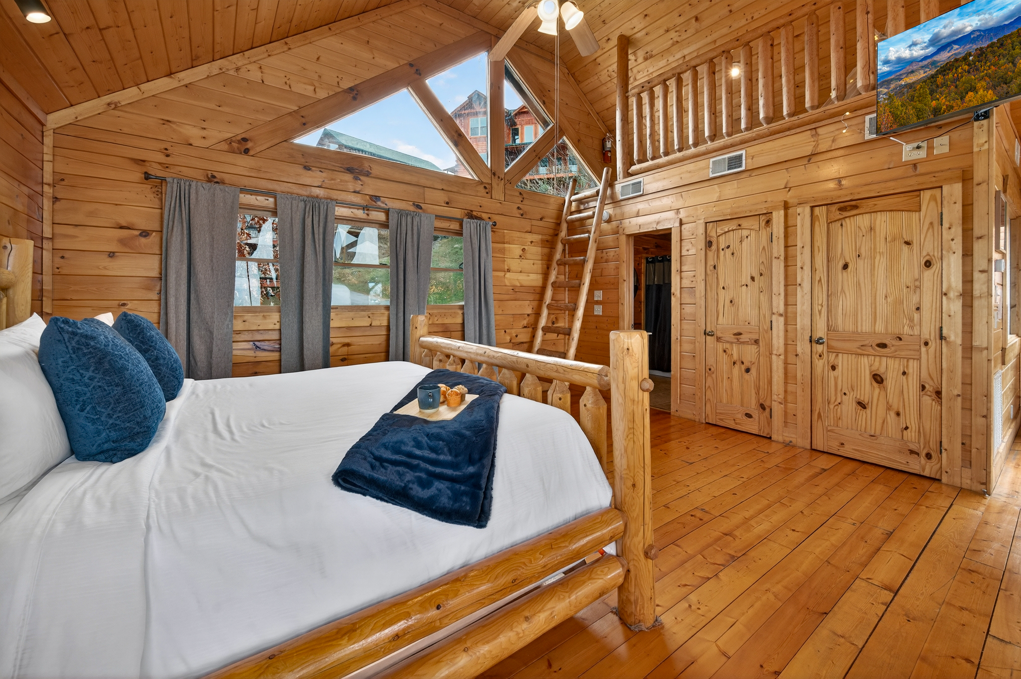 Upstairs Loft King Suite -ladder leads up to kid's hideaway.