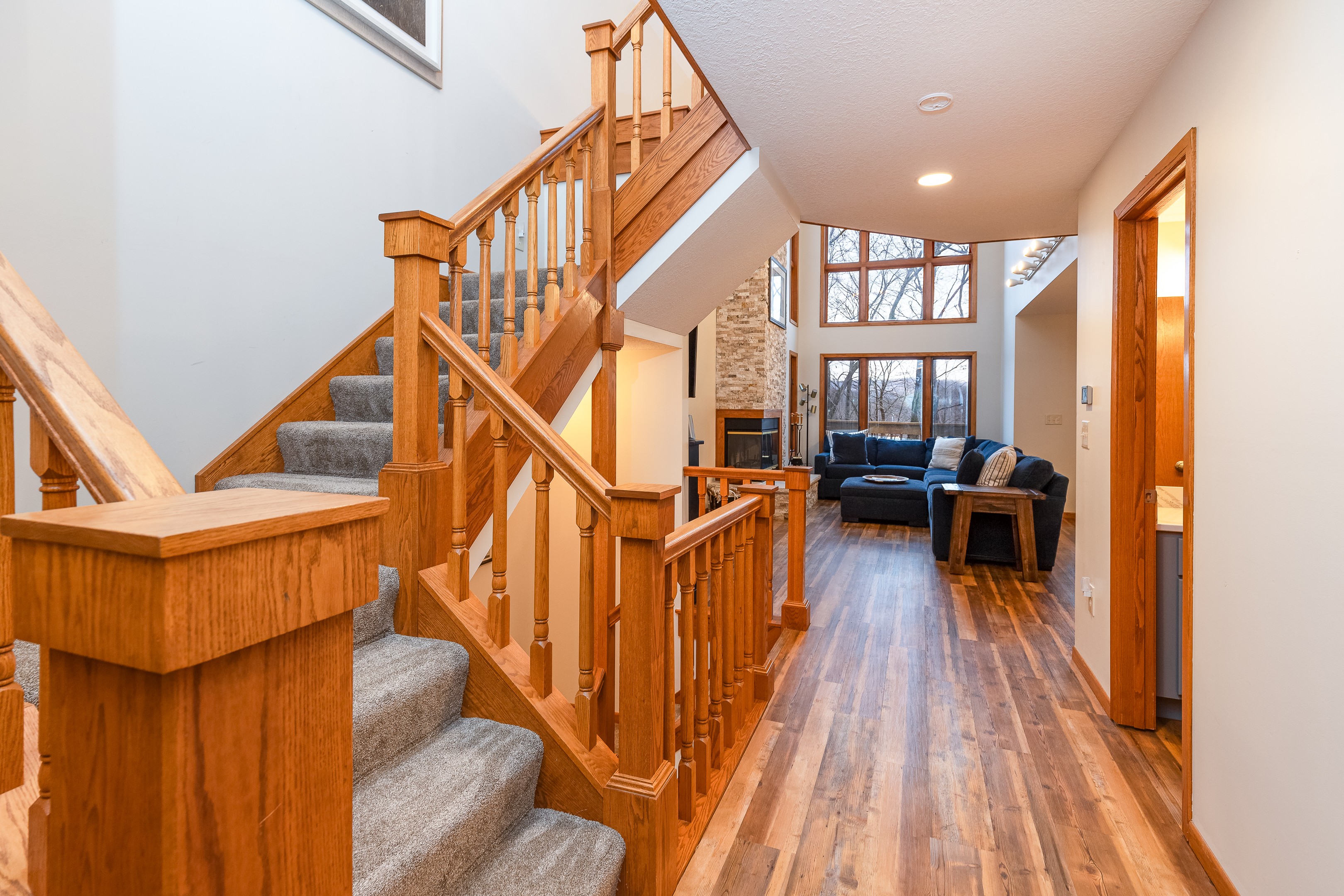 Steps leading upstairs to the Primary bedroom & steps to the lower level