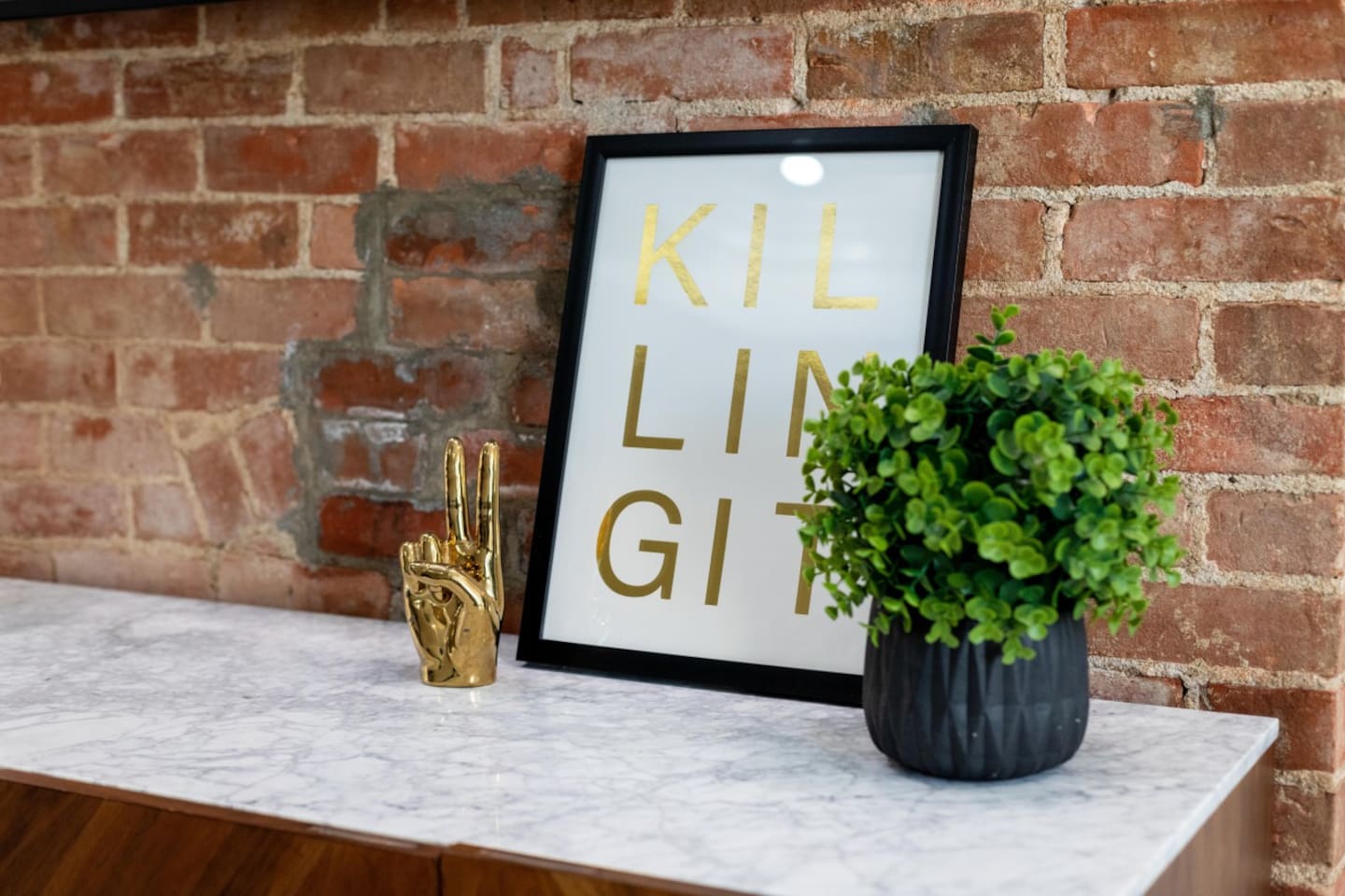 Our cozy space with chic decor and motivational art.