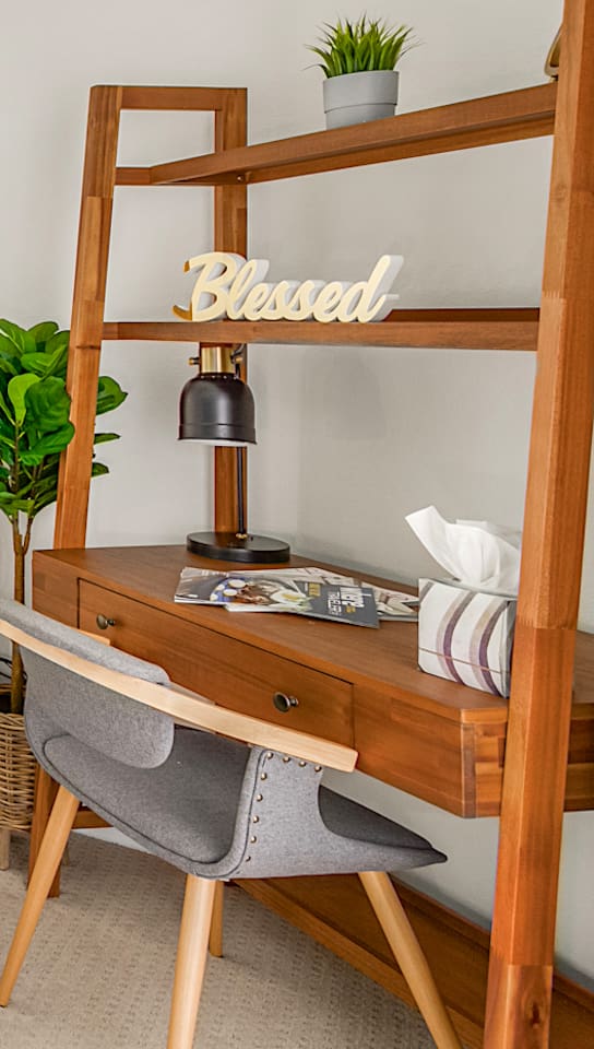 Work area with desk lamp and storage, useful for remote work or planning the day.