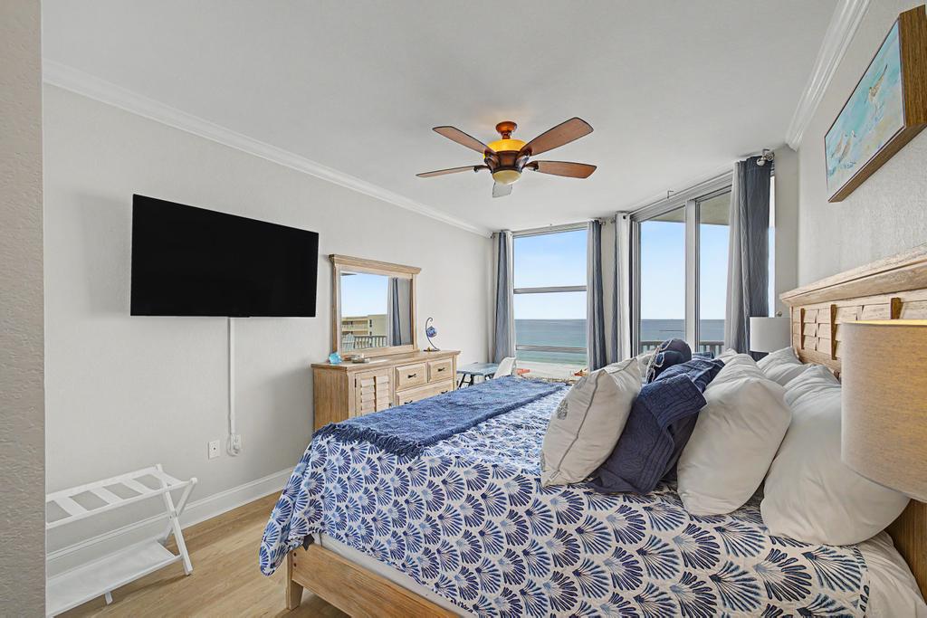 Master bedroom, King bed and wall mounted TV. Beautiful table can be used as desk or makeup table.