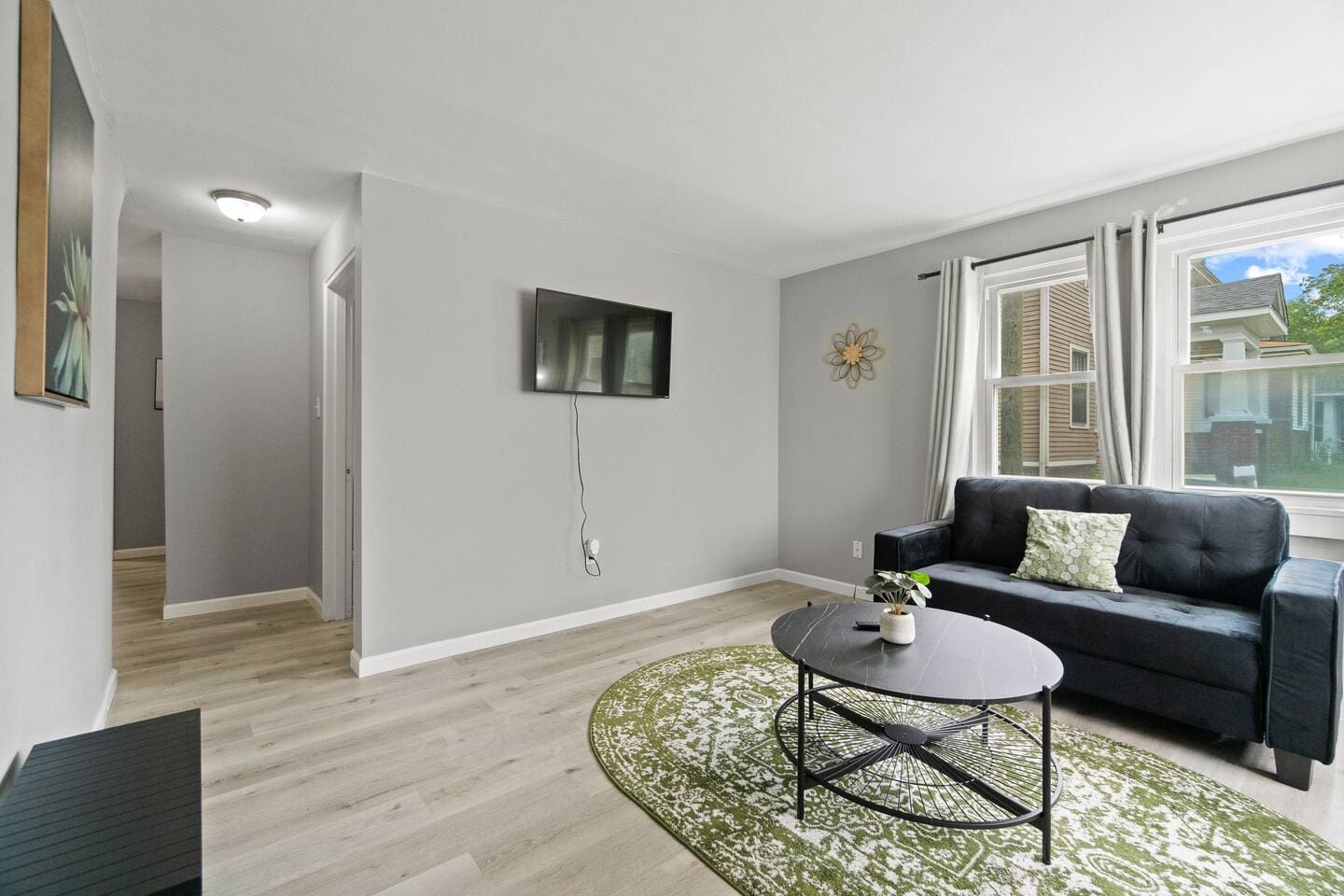 Modern living room with a flat-screen TV, offering the perfect spot for entertainment and relaxation.