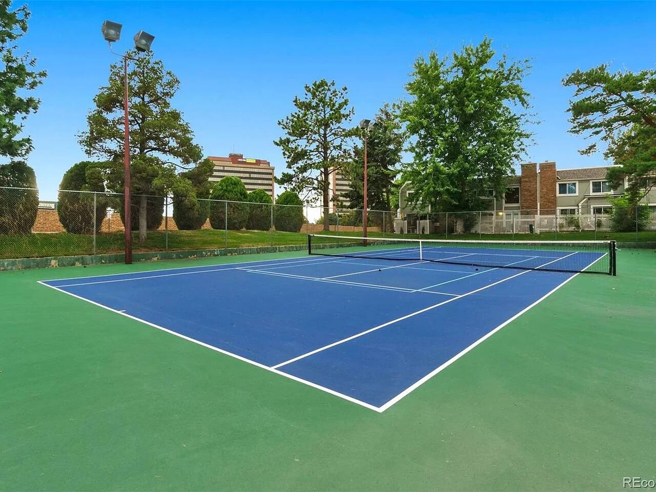 Community tennis court just a short walk from the home.