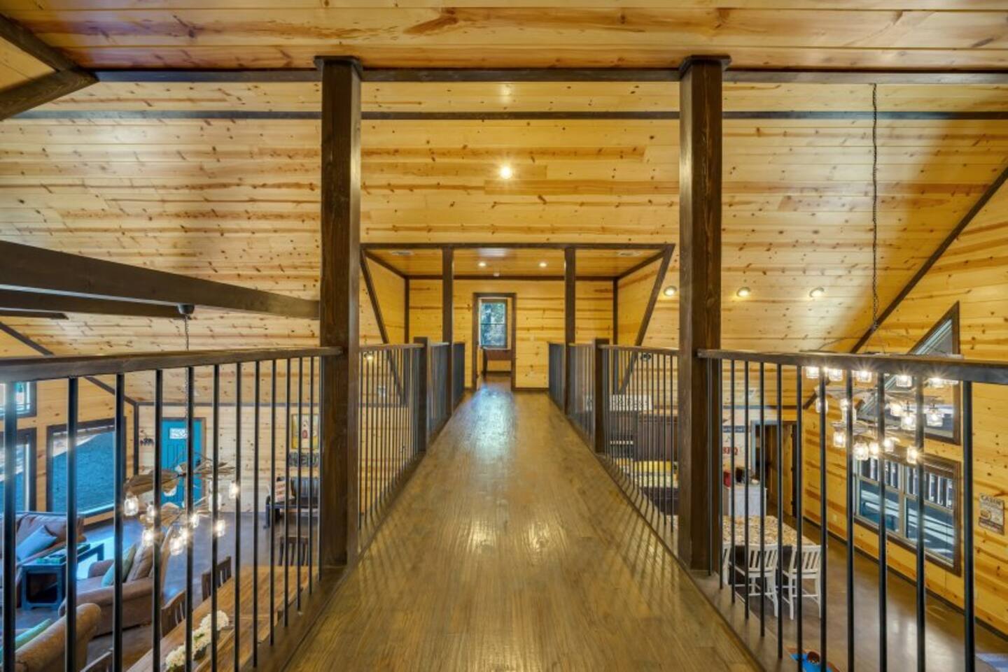 A warm, inviting upstairs hallway with forest views