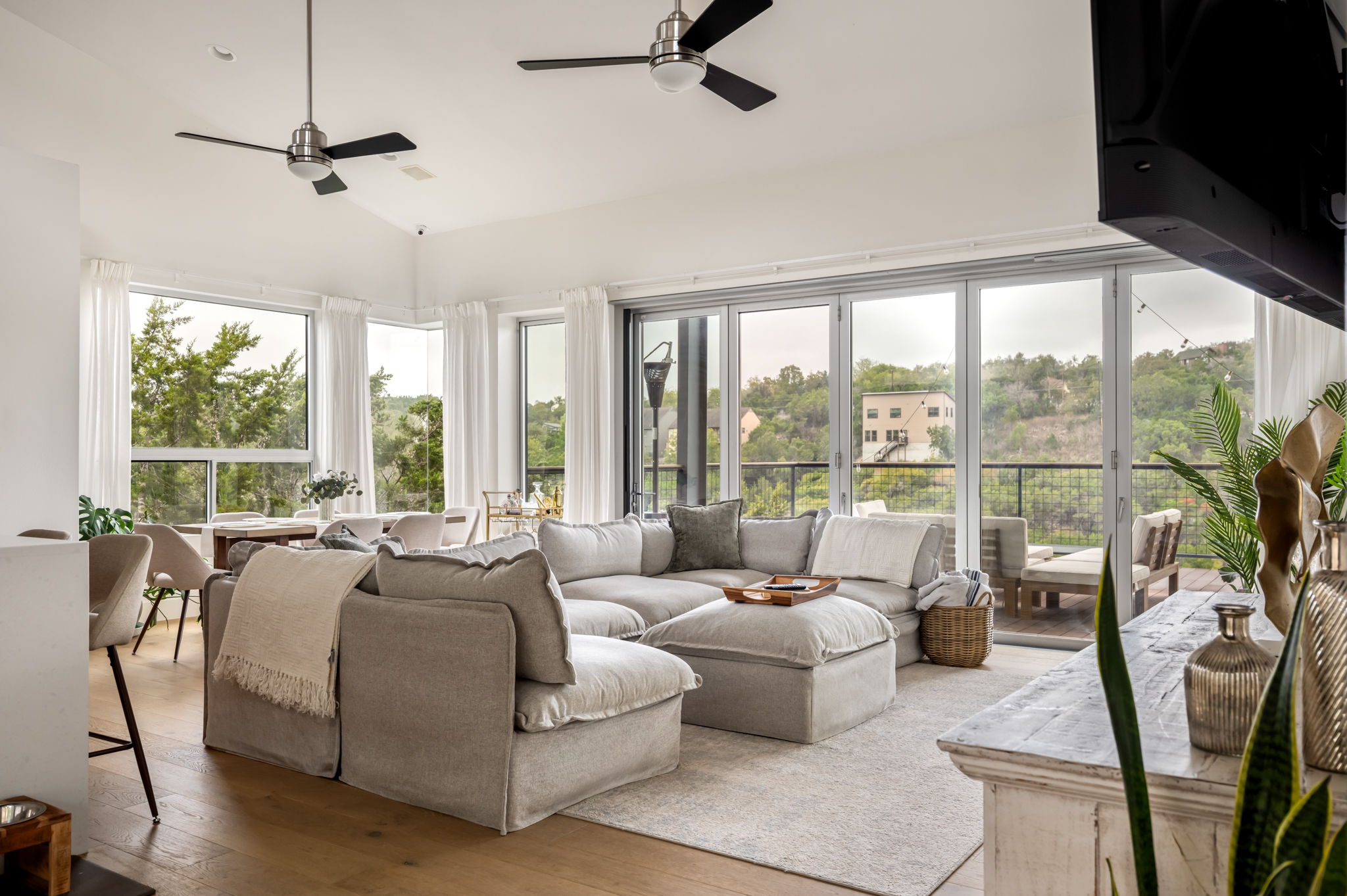 Bright living room with large windows and beautiful hill country views