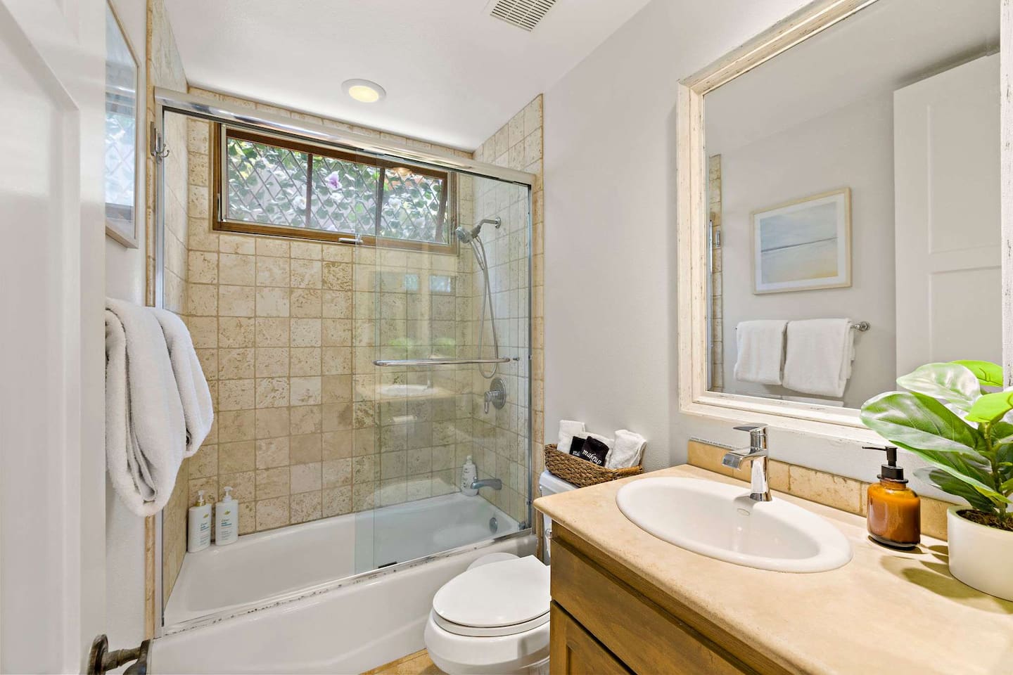 Our bright, clean hallway bathroom is also a full bathroom with a tub/shower and is fully equipped with soap, shampoo, and conditioner.