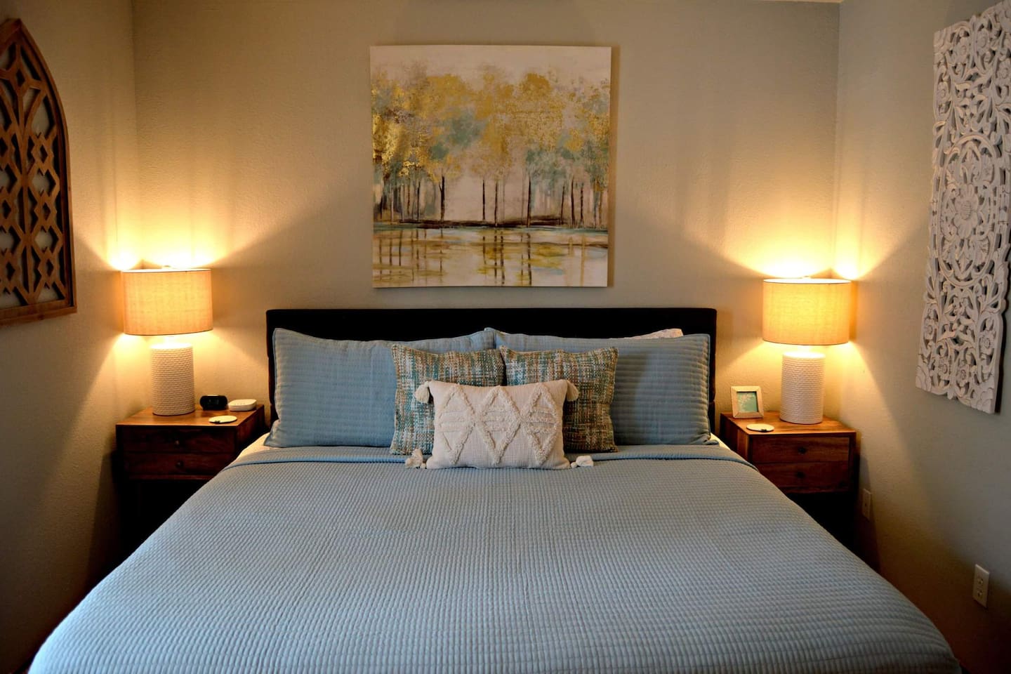 King bed in the bedroom with comfortable linens.