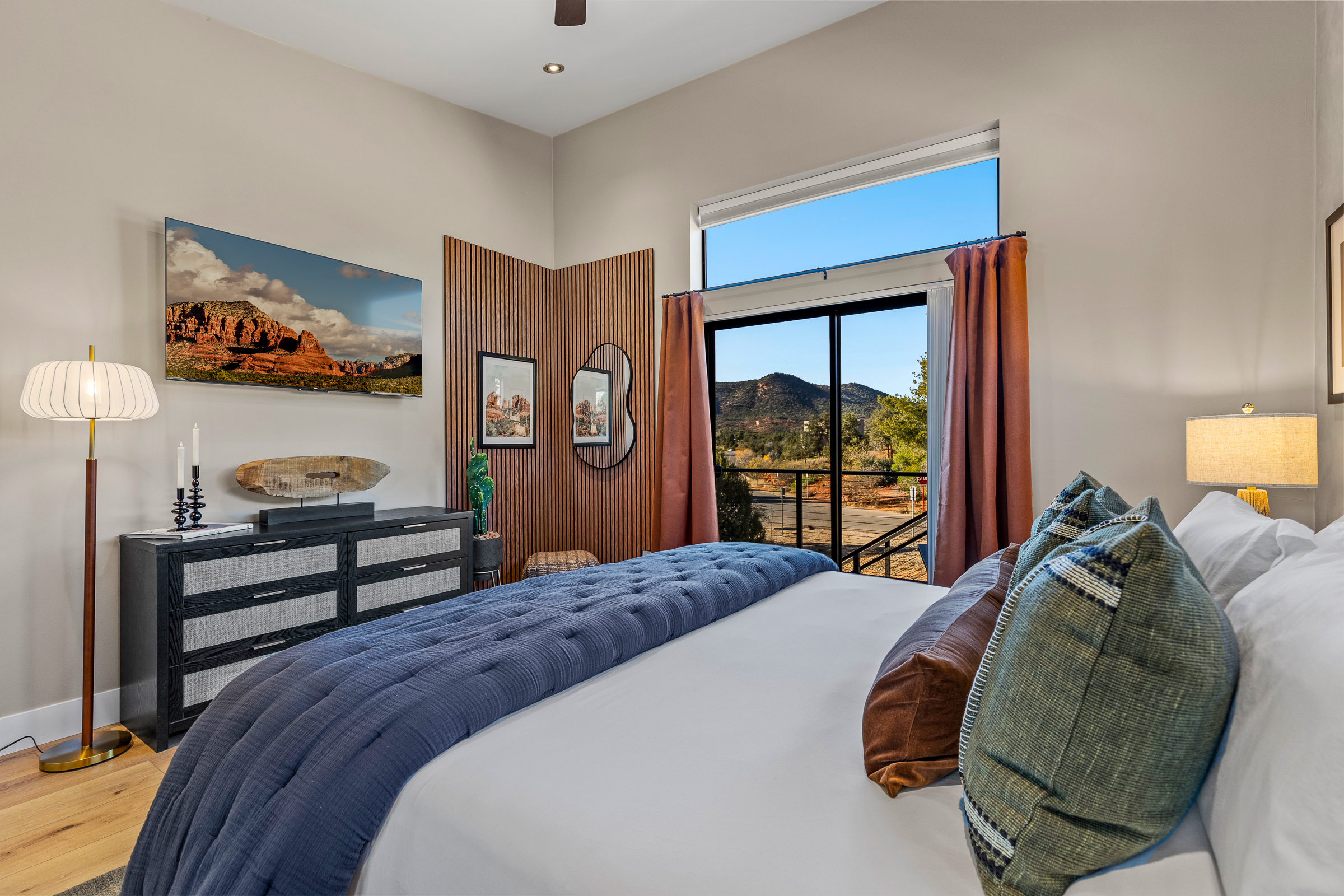 Large windows bring in natural light and desert views, giving the second bedroom a bright, open feel.