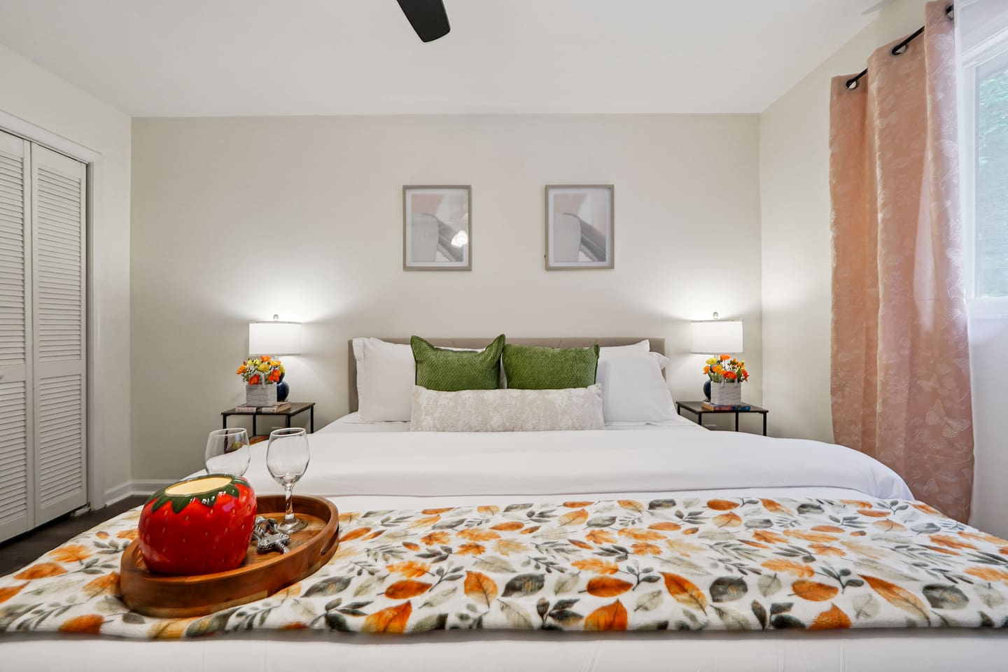 Master bedroom featuring a comfortable king bed and an Amazon Fire-powered Smart TV. The shared bathroom is conveniently right next door. This room includes 2 full-body towels, 2 washcloths, and 2 hand towels for your stay.