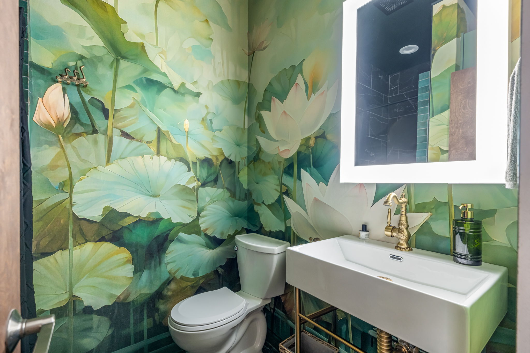 Stylish bathroom with modern vanity and bold designer wallpaper