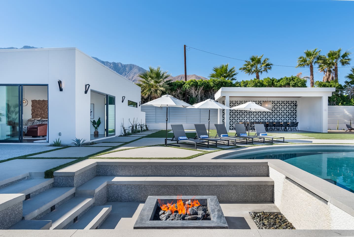 Sunken fire pit with waterfall and seating