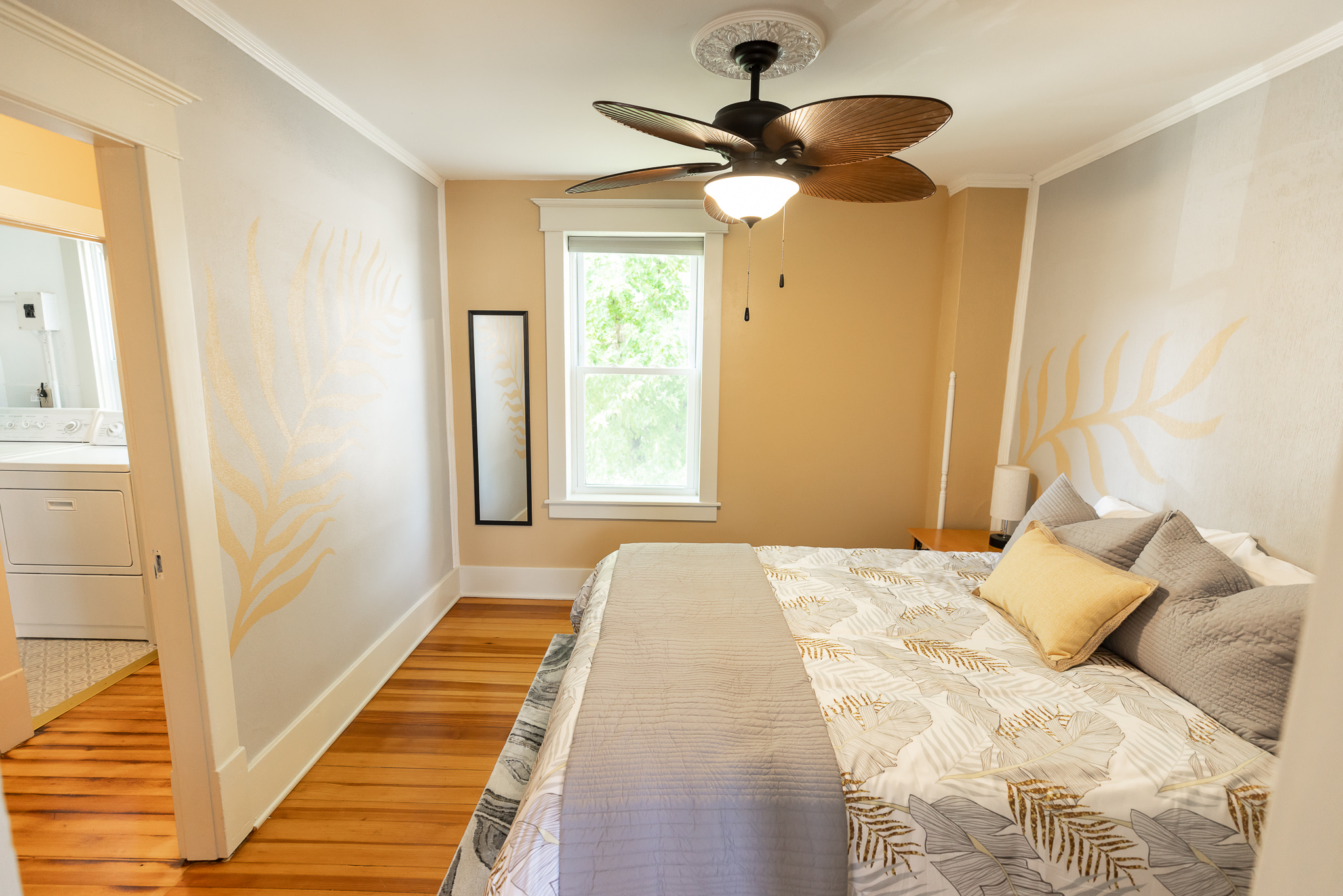 The second bedroom is more spacious with a queen bed and a walk through closet to the attached full bath.