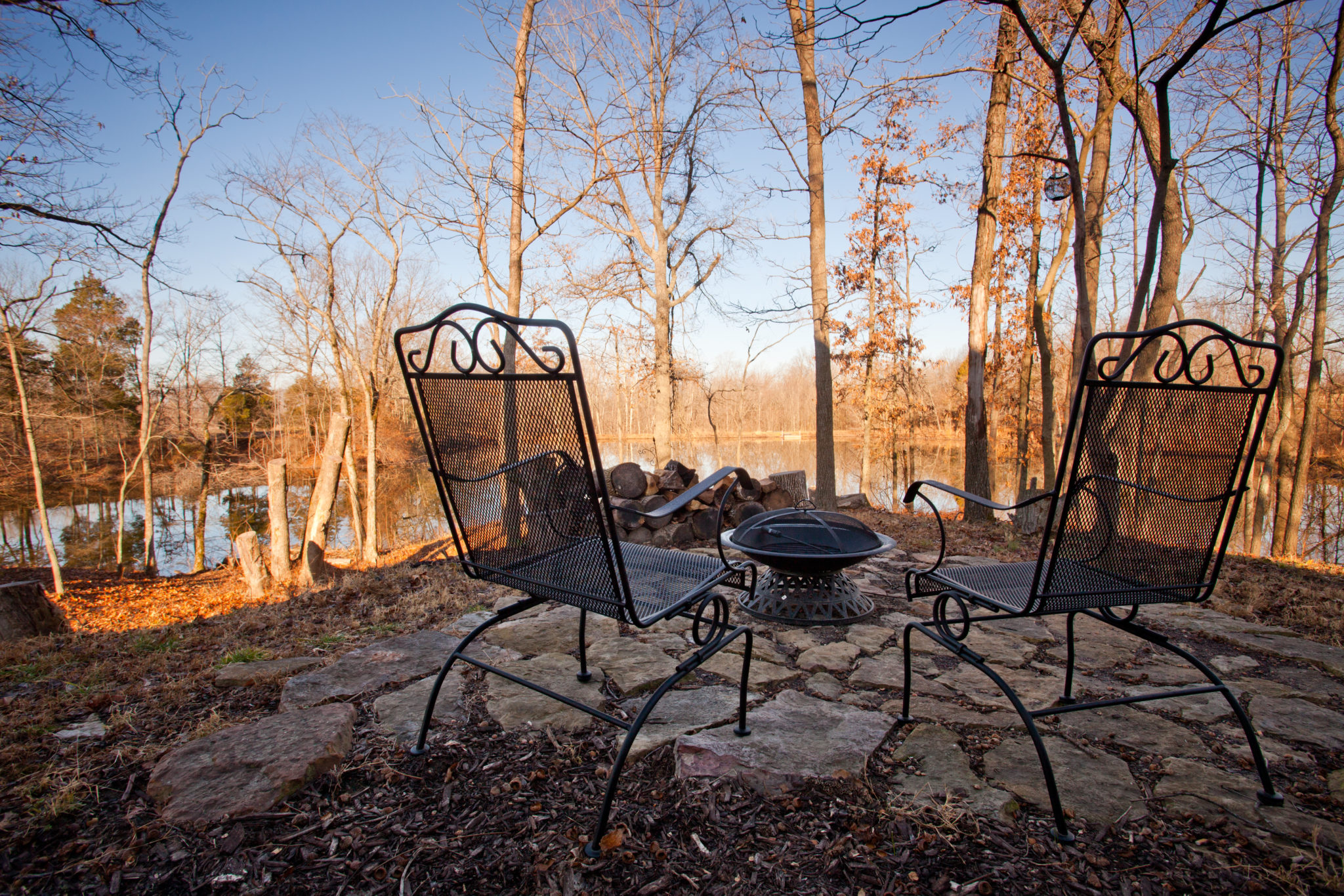 Wood fire pit overlooking the pond