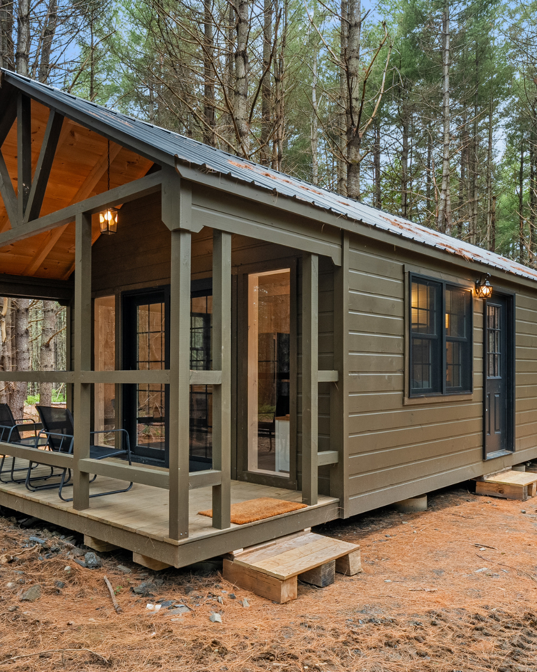 Private cabin with porch in a wooded setting