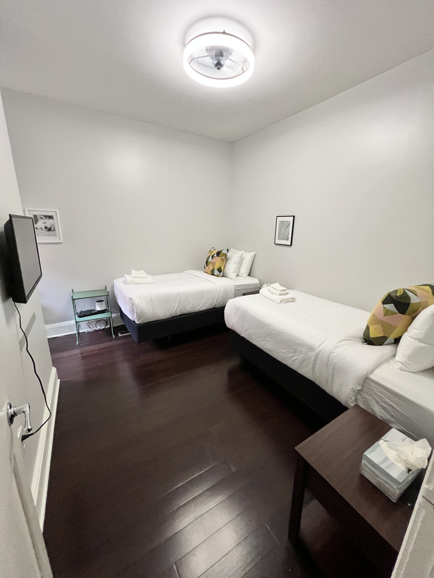 Guest bedroom with two brand-new Beautyrest twin beds and a 32" Roku Smart TV—perfect for friends, kids, or anyone who appreciates flexible sleeping arrangements and easy streaming.