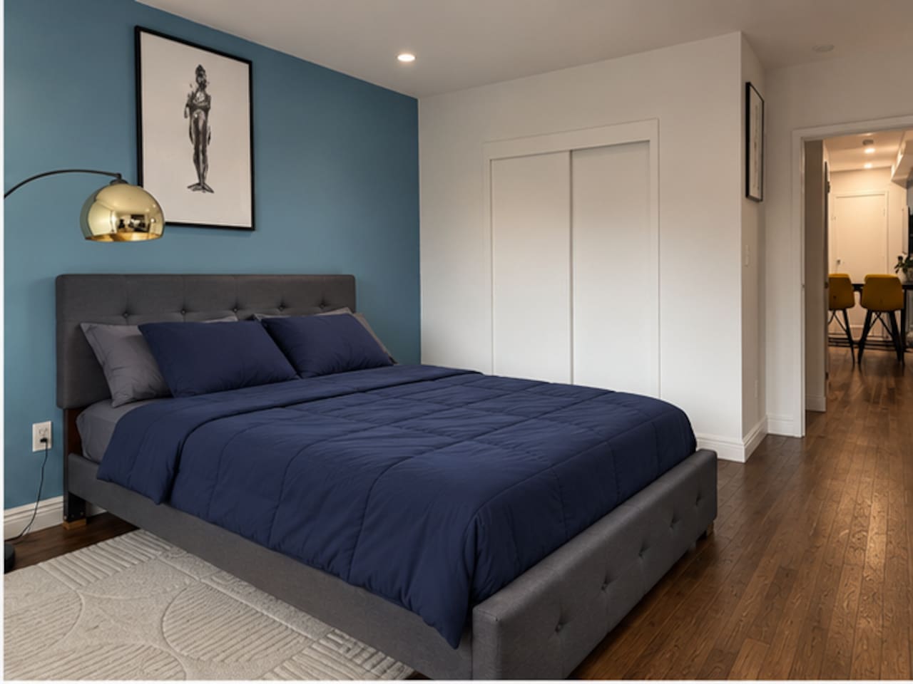 Primary bedroom with sweeping NYC city views — Little Italy Manhattan 2-bedroom apartment