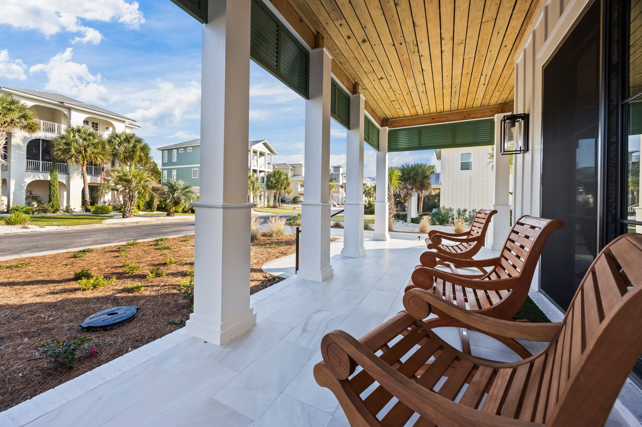 Relax on the front porch and take in the charm of this walkable coastal neighborhood. Enjoy views down Osprey Circle as neighbors stroll, bike, and pass by on golf carts with friendly waves. Rock for a while and feel at home, with the beach just a short w