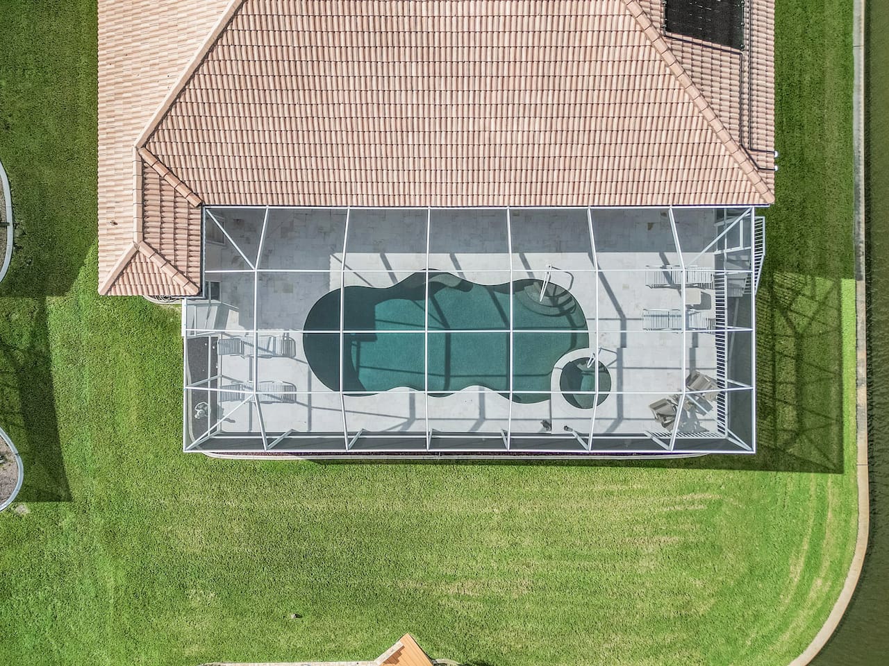 Aerial view showcasing the pool area and its stunning surroundings from above!