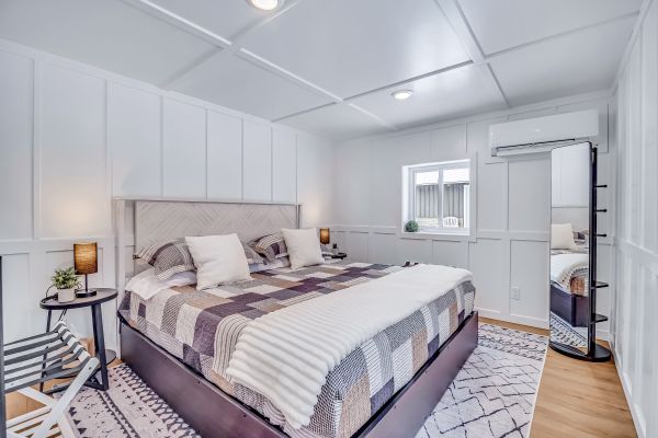 2 windows with views of the woods and sunset. Sliding barn door, King bed.