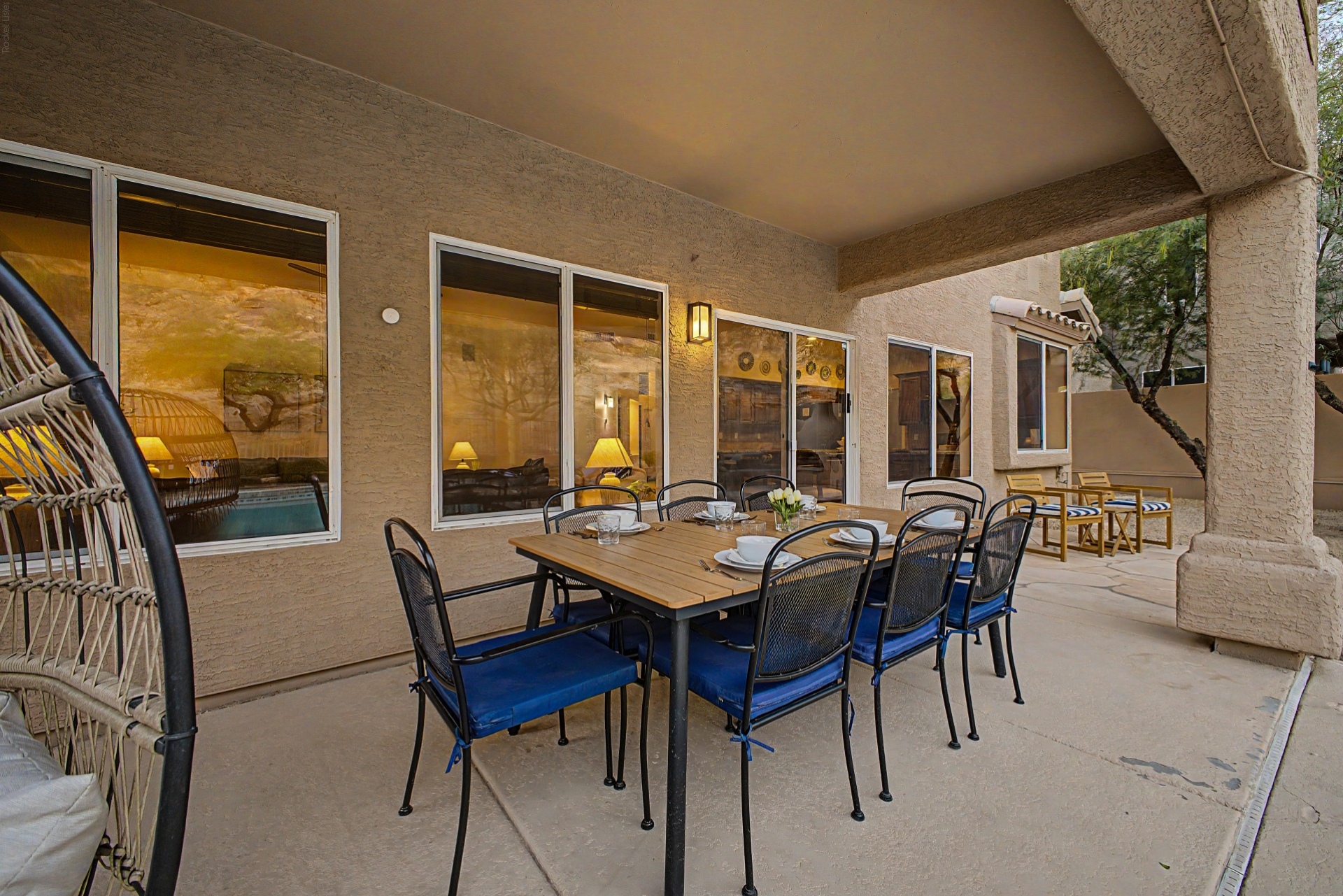 Backyard dining table, egg chair 