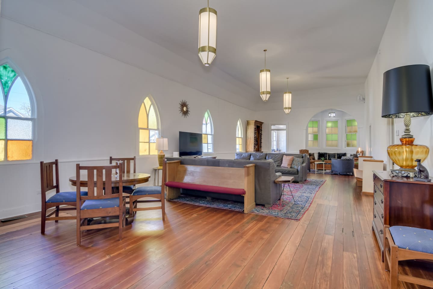Open living space connecting seamlessly to dining and kitchen.