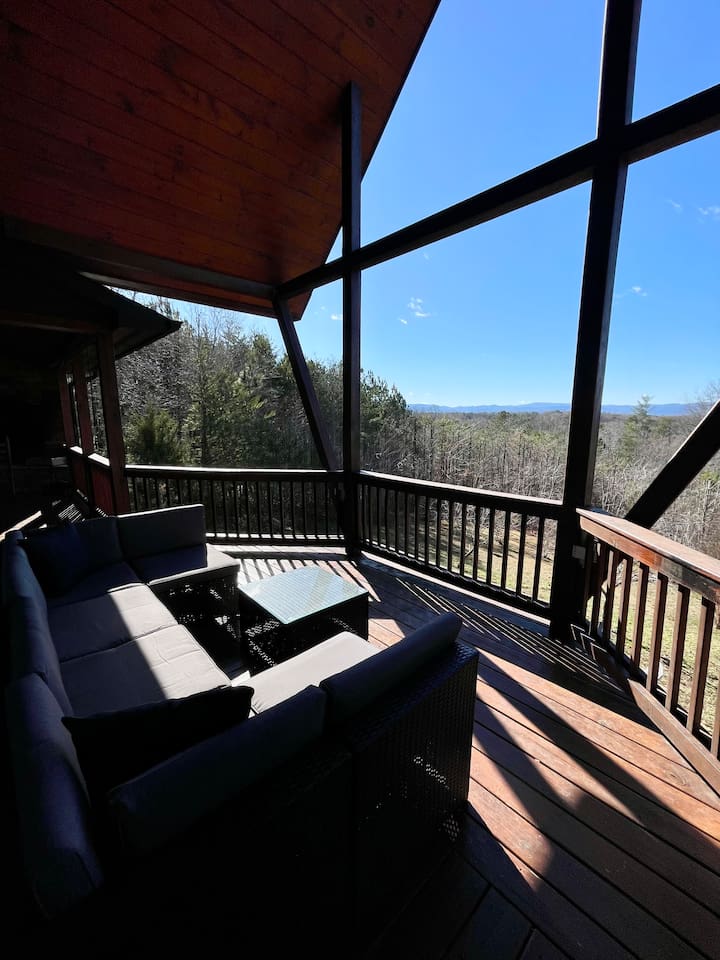 Mountain views from the wrap-around porch, large outdoor couch on the back deck a-frame overlooking the back yard! 