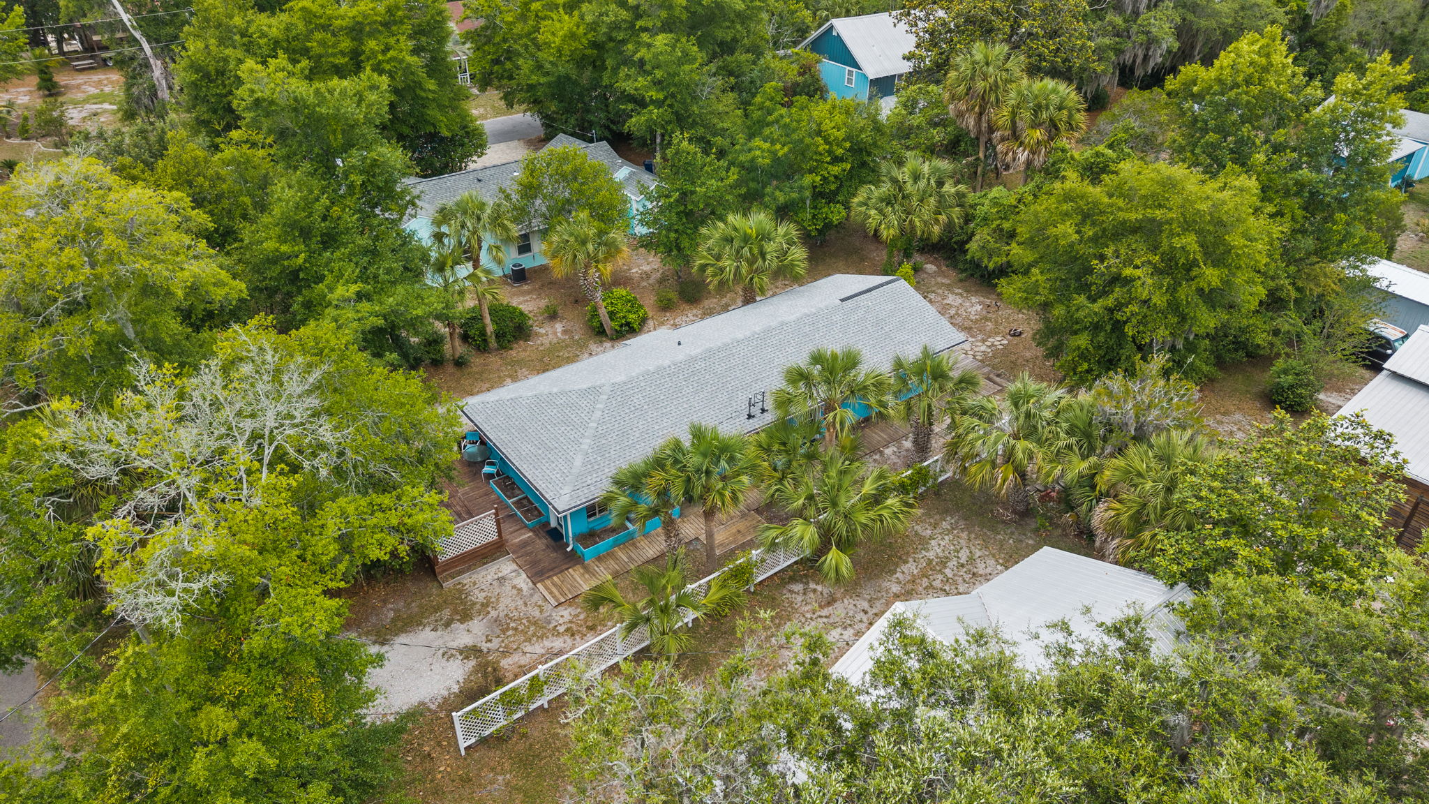 Aerial view of the property and surrounding neighborhood