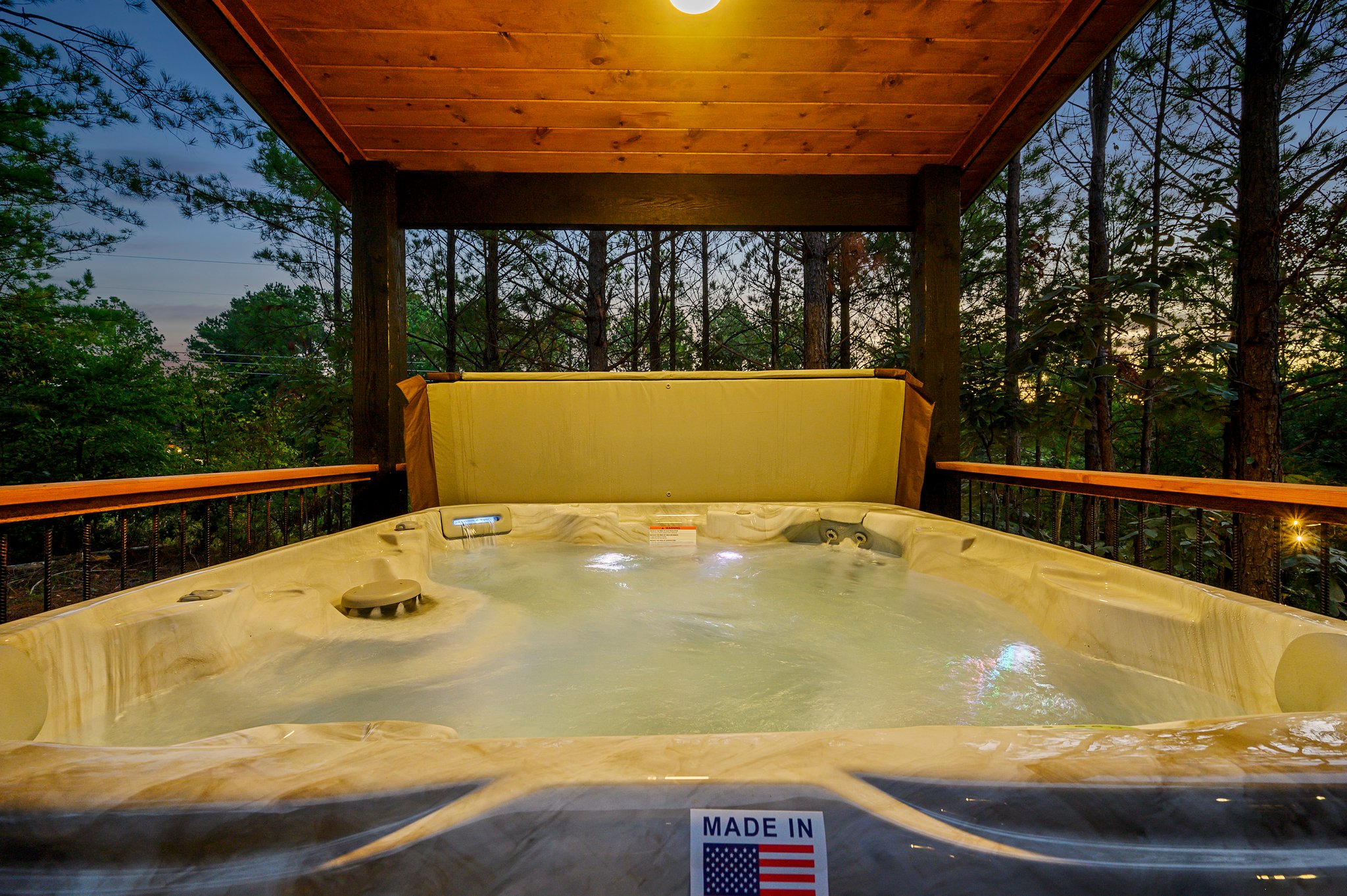 Unwind in the bubbling hot tub under a cozy starlit pavilion.