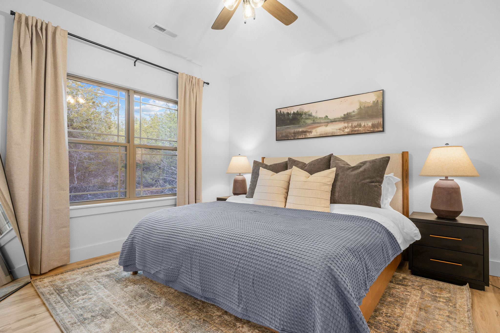 A calm, inviting bedroom designed for rest and comfort.