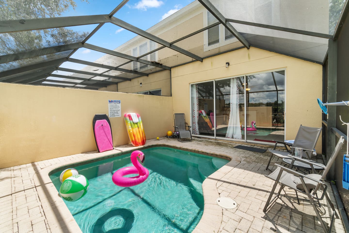 - Screened in pool area with lounge chairs, fun floaties, and sunny vibes  
- Private space perfect for cooling off, sunbathing, or enjoying evening swims  
- Direct access from the living room makes it ideal for family poolside fun  