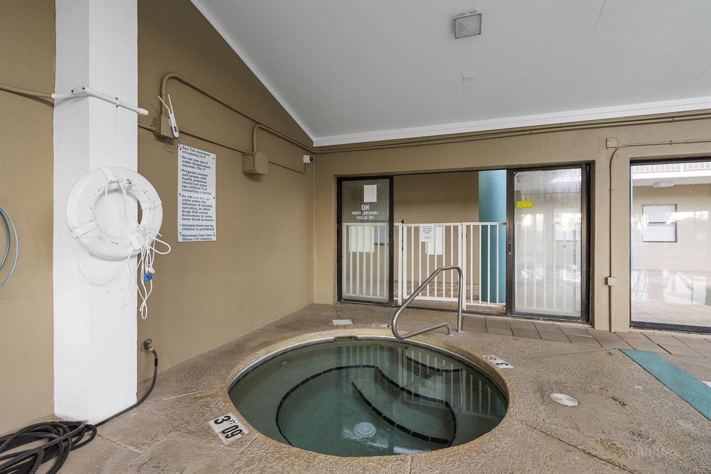 Hot tub in shared atrium pool area - beach towels provided by us!