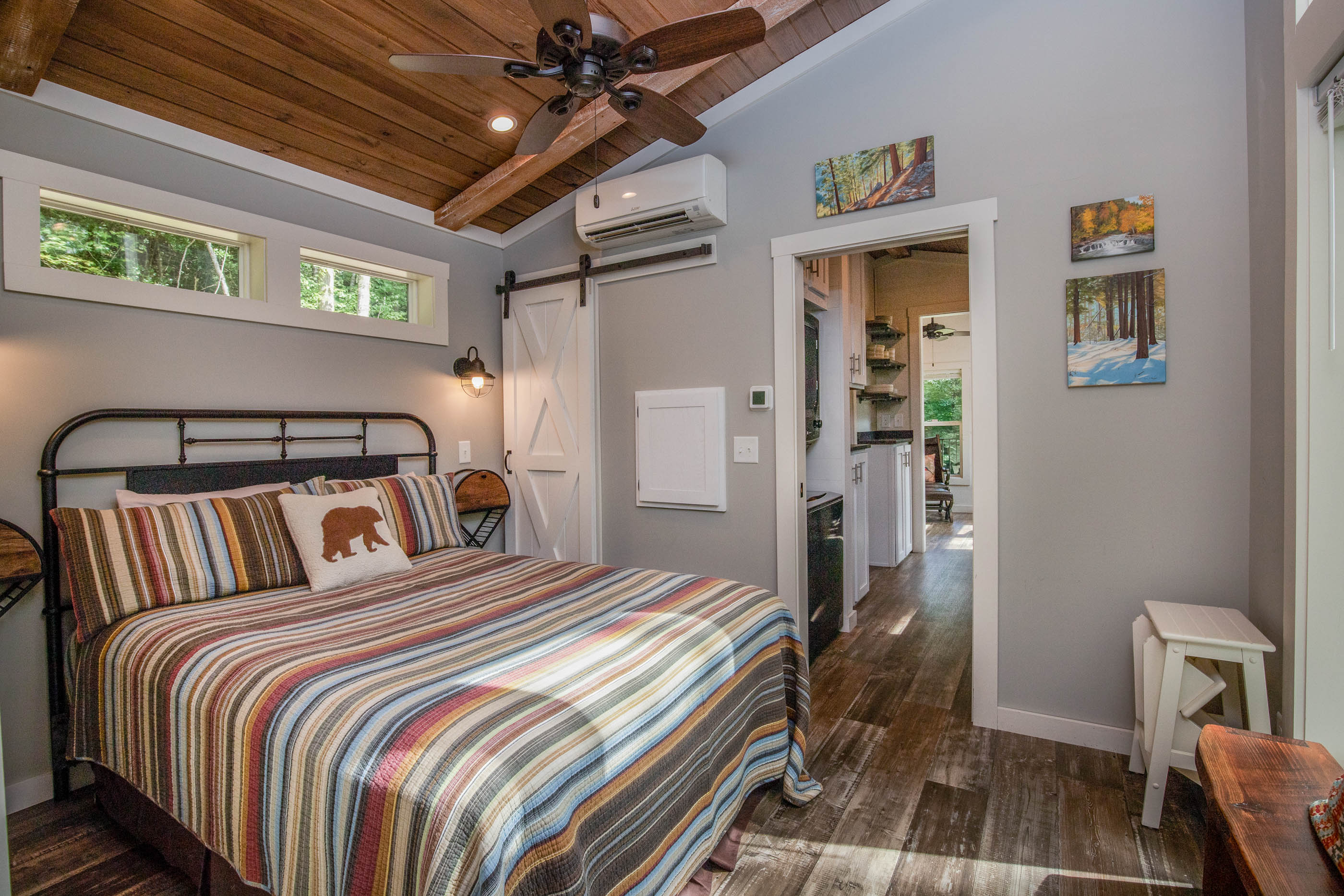 A plush queen bed, soft linens, and space for your belongings—comfort at the heart of your stay.
