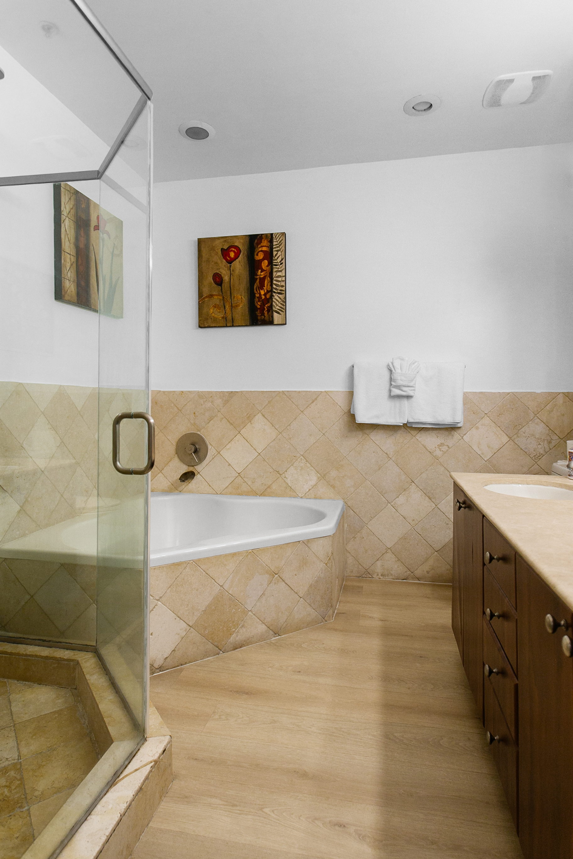 Primary Suite en-suite with separate tub and walk-in shower, double-sink vanity